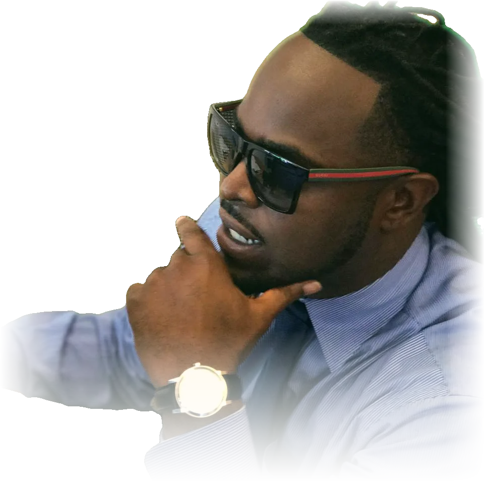 Jamaican, the Jamaican Car Plug, in sunglasses and a dress shirt